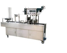 Water fiiling and sealing machine