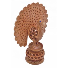 handmade wooden figurine peacock