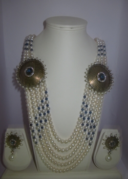 5 row pearls set with blue side broch