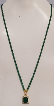 Natural emerald and diamonds in gold pendant with emerald bead necklace
