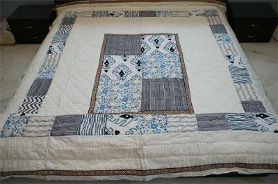 patch-block print bed-sheet quilt