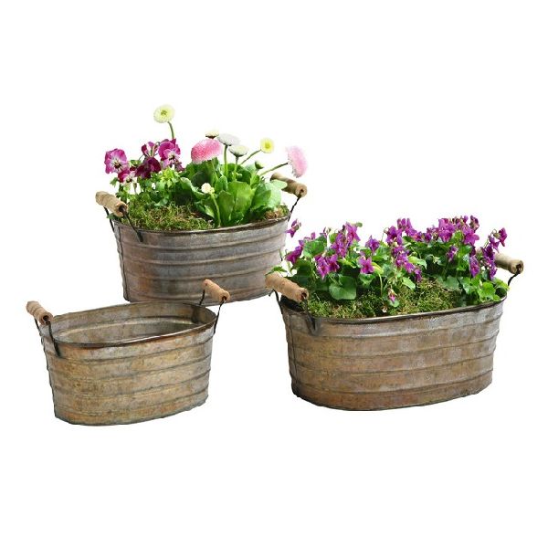 Oval Polished Iron Planters, for Decoration, Outdoor Use Indoor Use, Portable Style : Standing