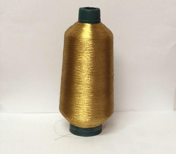 Cotton zari gold threads, for Embroidery Knitting, Sewing Clothes, Stitching, Weaving, Packaging Type : Reel