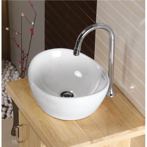 Round Ceramic Polished Table Top Wash Basin, for Home, Hotel, Restaurant, Feature : Perfect Shape