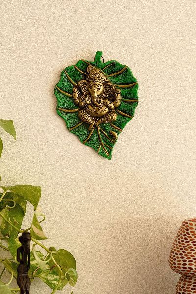 Clay Powder Ganesha Leaf Door Hanging, for Home Decoration, Feature : Attractive Designs, Fine Finishing