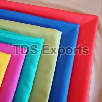 Spun Polyester Fabric, for Garments, Fabric Weight : 50-100g/sqm, 100-180g/sqm