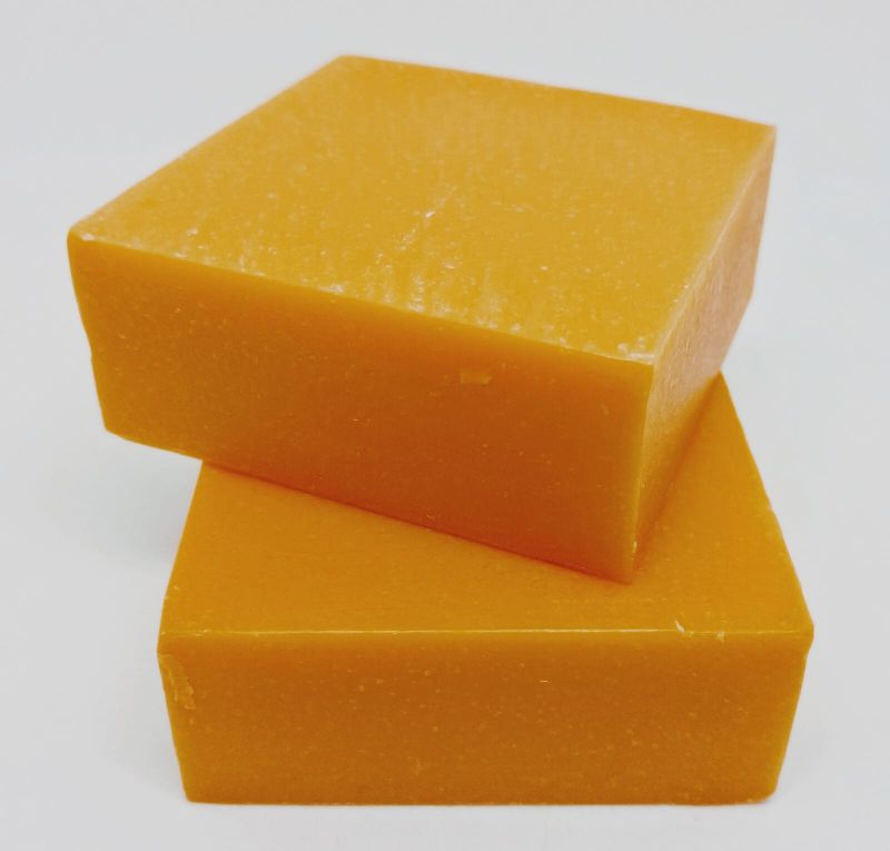 Solid Square 100gm Orange Soap, for Bathing, Packaging Type : Plastic Box