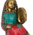 Woman Holding Dafli Figurine