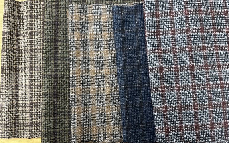 Checked Tweed woolen fabric, for Textile, Feature : Comfortable, Easily Washable, Impeccable Finish