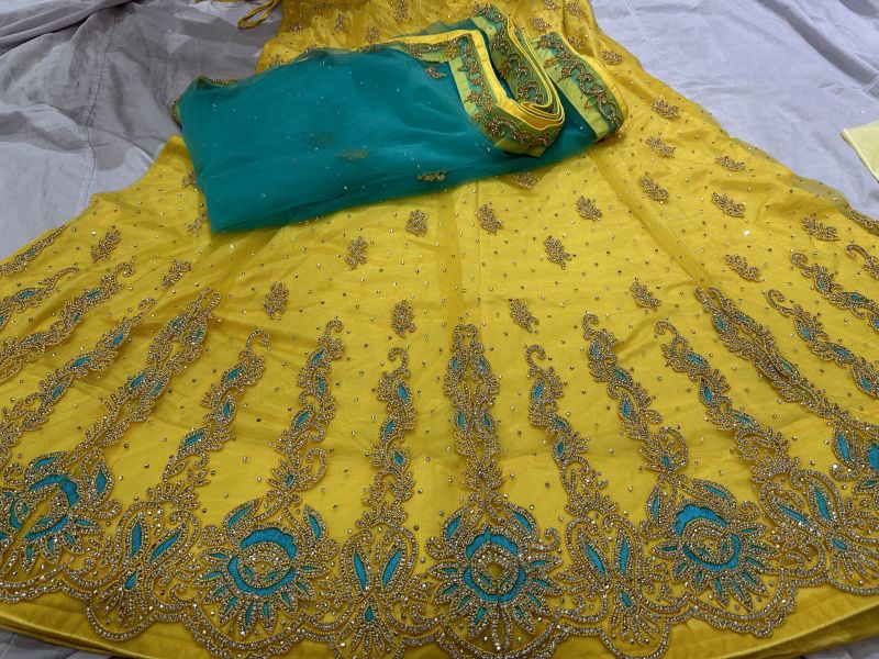 Ladies Yellow Fancy Net Lehenga Choli, Feature : Eco Friendly, Easy Washable, Dry Cleaning