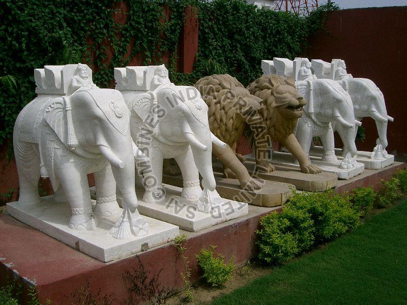 CARVED MARBLE  STONE ELEPHANT AND LION STATUES