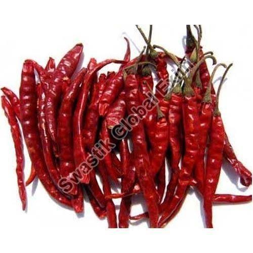 Solid Raw Natural Kashmiri Red Chilli, for Spices, Specialities : Long Shelf Life, Rich In Taste