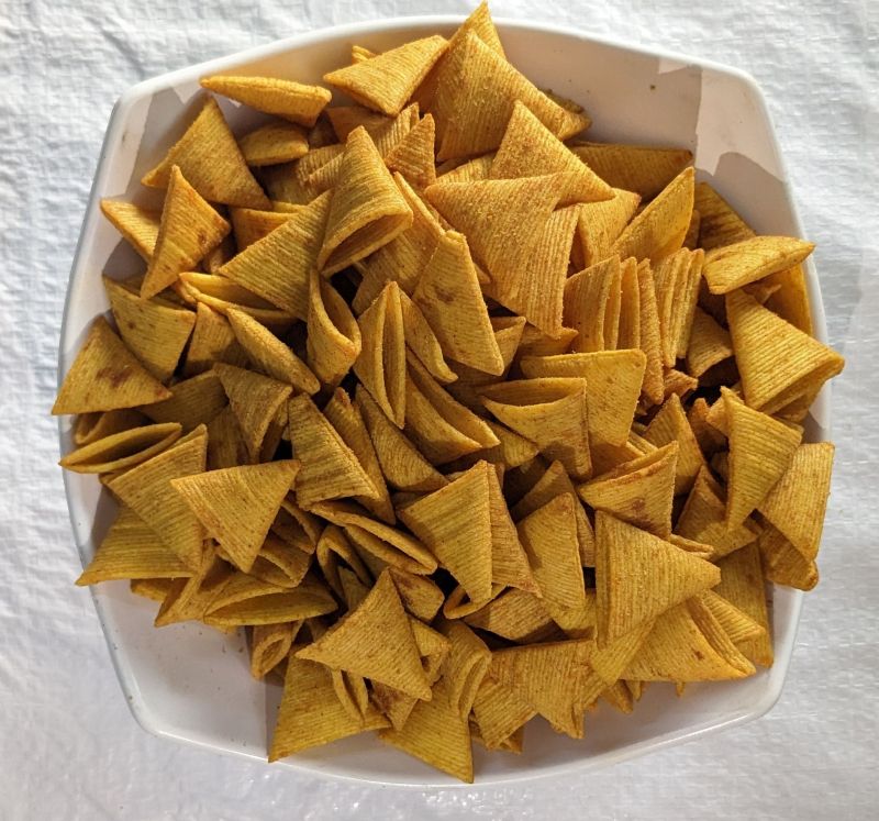 Shraddha Yellow Masala Triangle Chips, for Snacks, Style : Fried