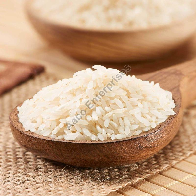 Solid Hard Common Ponni RIce, for Cooking, Food, Human Consumption, Packaging Type : Jute Bags