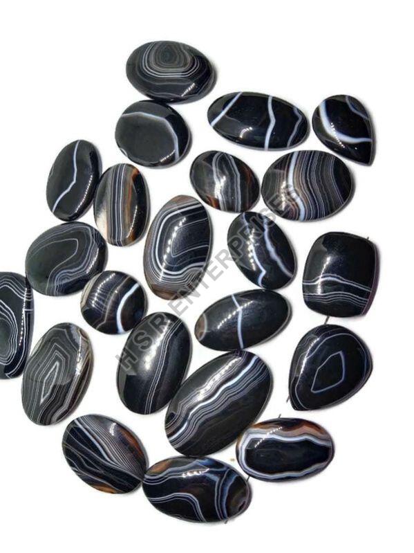 Polished Black Banded Cabochon, for Bracelet, Earring, Necklace, Feature : Healing, Serenity, Peace