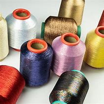 Polyester Metallic Yarn, for Weaving, Sewing, Knitting, Filling Material, Embroidery, Feature : Low Shrinkage