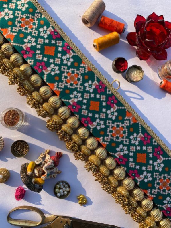 Maroon Bottle Green Navratna Tasseled Toran