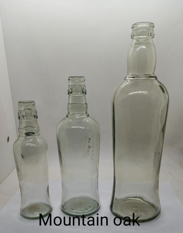 Transparent Mountain Oak Glass Liquor Bottle, Storage Capacity : 750ml, 350ml, 180ml
