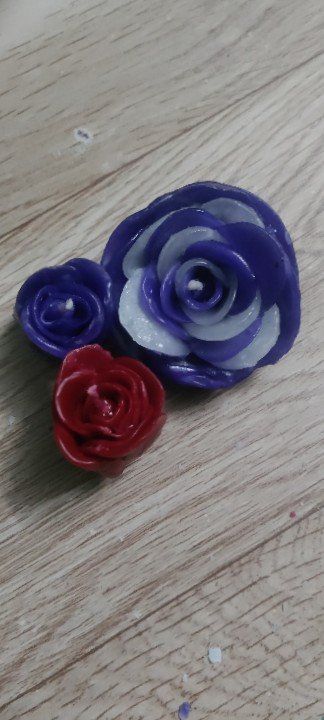 Glossy Paraffin Wax Flower Shaped Handmade Candle, for Party, Lighting, Decoration, Speciality : Smokeless