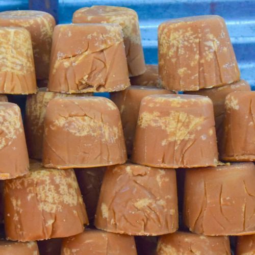 Brownish Jaggery Blocks, Shape : Round for Food, Medicine, Beverages