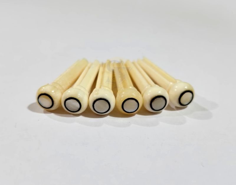 Bone with White Mop Eye Dots Bridge Pins