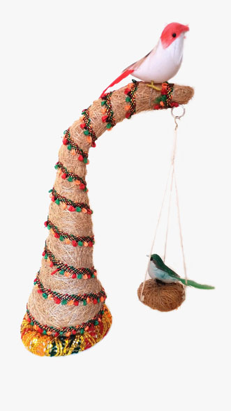 Coconut handicraft tree with hanging bird nest