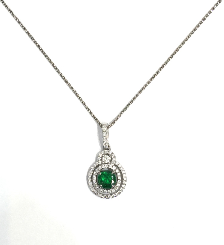 Emerald in double halo diamond
