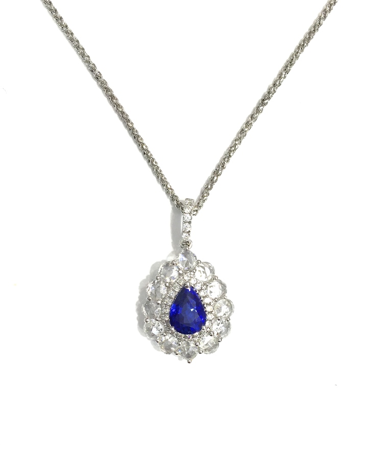 Pear shaped blue sapphire pave diamonds
