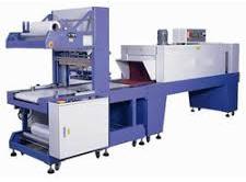 Automatic shrink wrapping machines