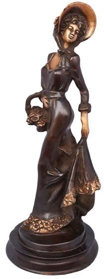 Lady with basket a handmade metal craft with antique finish