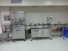 Desiccant canister packing machine