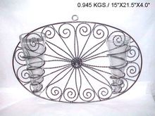 Metal wall decoration with glass flower vase