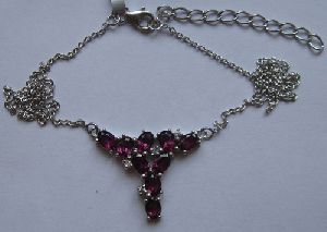 Gold Necklace With rhodolite and w. topaz