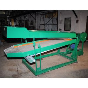 STALK EXTRACTOR AND GRADING MACHINE