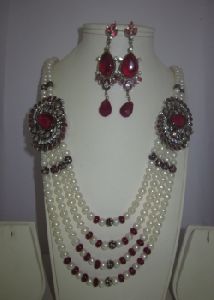 4 row pearl set with red side broch