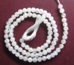 White rainbow plain round beads