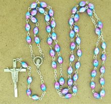 Rosary made of ovel glowing beaded with pink colour