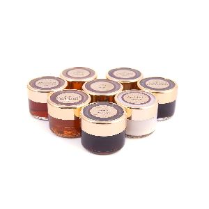 ASSORTED BEE HONEY IN A WOODEN BOX, 28.3G X8