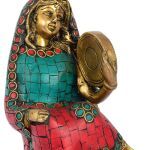 Woman Holding Dafli Figurine