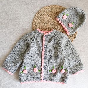 Handknitted Cardigan with matching cap and floral appliques