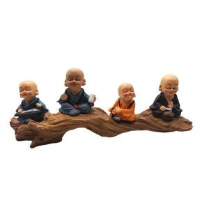 Sitting Little Monk On Wooden Platform