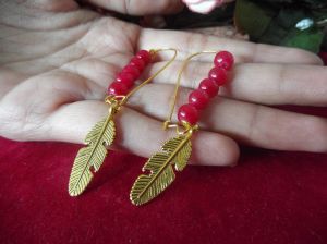 Golden Oxidized Earrings With Red Beads