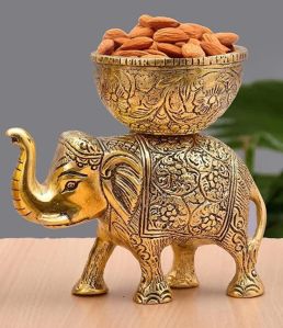 Gold plated brass elephant with bowl on it