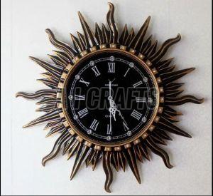 Metal & Glass Sunburst Brown Wall Clock, Shape : Round