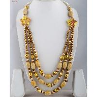 Fashion Necklaces - three-layered neck piece attached to white Pearls.