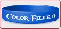 COLOR-FILLED SILICONE WRISTBANDS