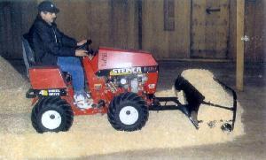 wood shavings spreader on Steiner tractor
