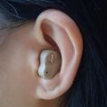 Beige mini hearing aid