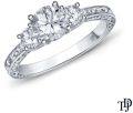 An Antique Scroll Design Three Stone Engagement Ring With Center Diamond
