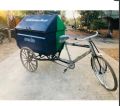 Green tricycle rickshaw